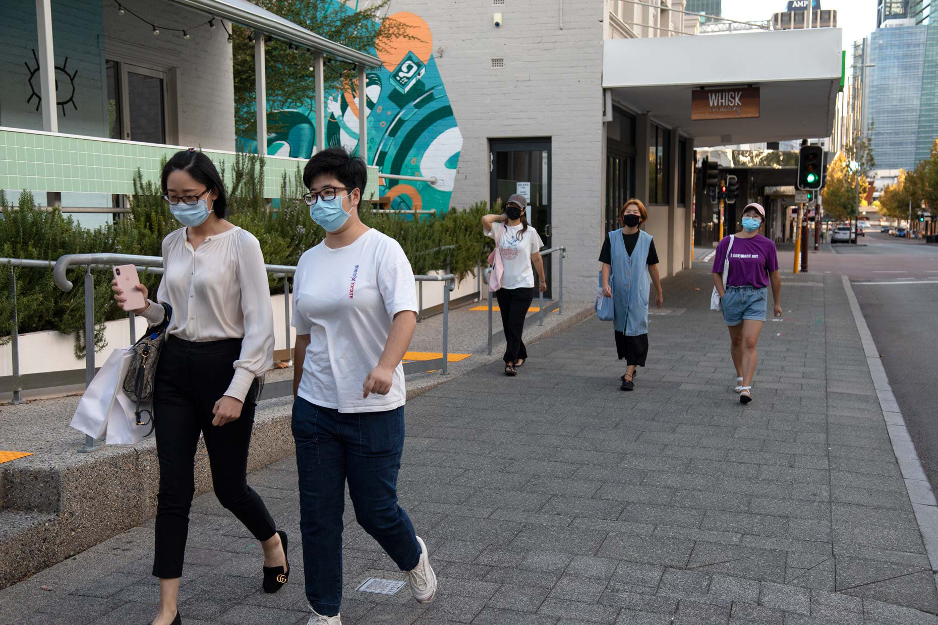 Young women wearing face masks during COVID-19 lockdown on William Street