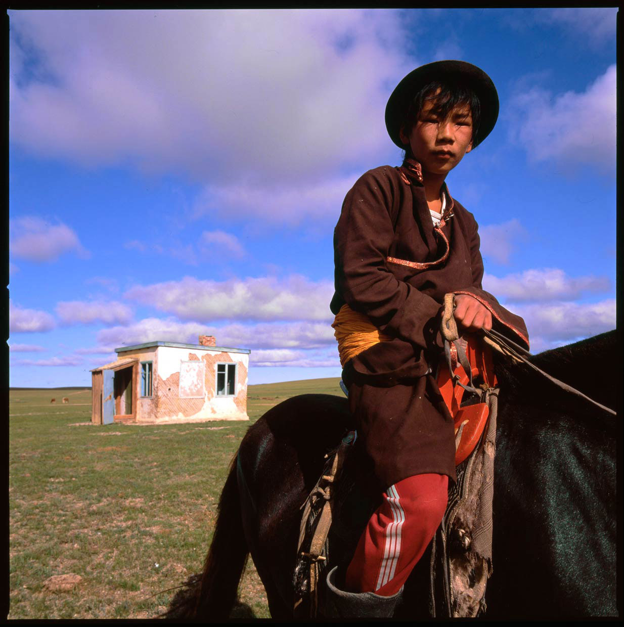 Mongolia_herder-boy-on-horse